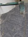 Robed figure w. trident