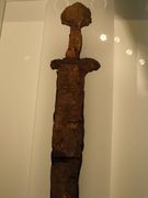 Sword in leather scabbard